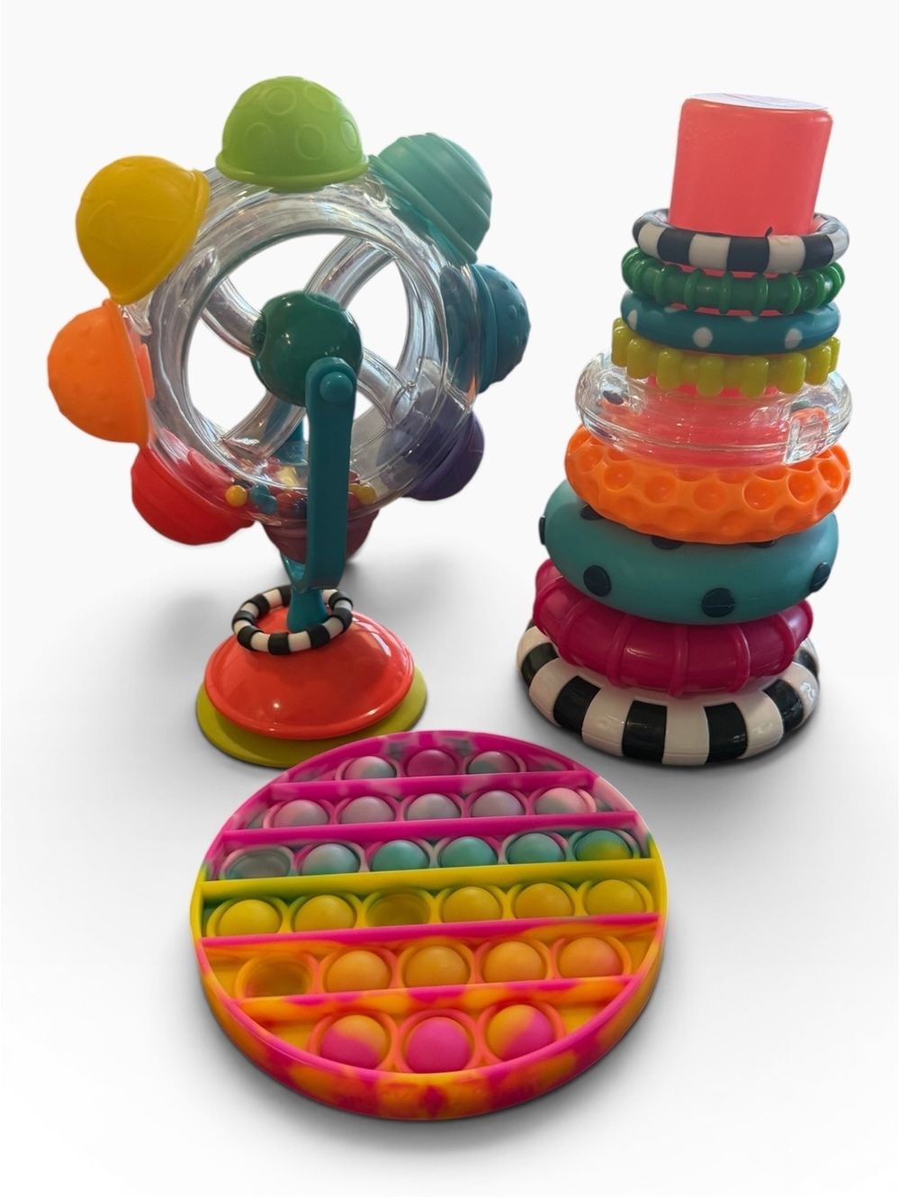 Sassy Developmental Baby Toys Set with Stacking Rings, Spinner, and Sensory Pop-